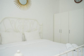 Strategic and Homey 2BR at Puri Garden Apartment near Mall By Travelio